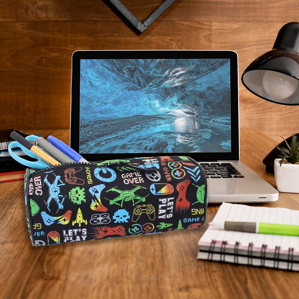 Pencil case with gaming-themed design on a desk with a laptop and stationery items.